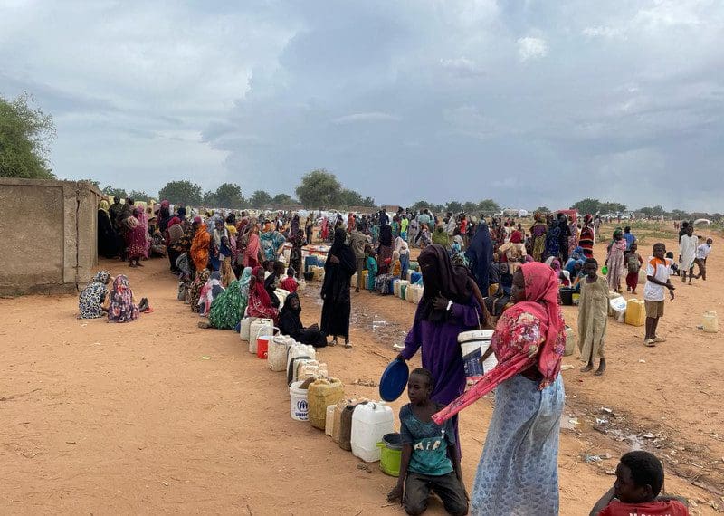 Displaced Sudanese wait for humanitarian assistance.